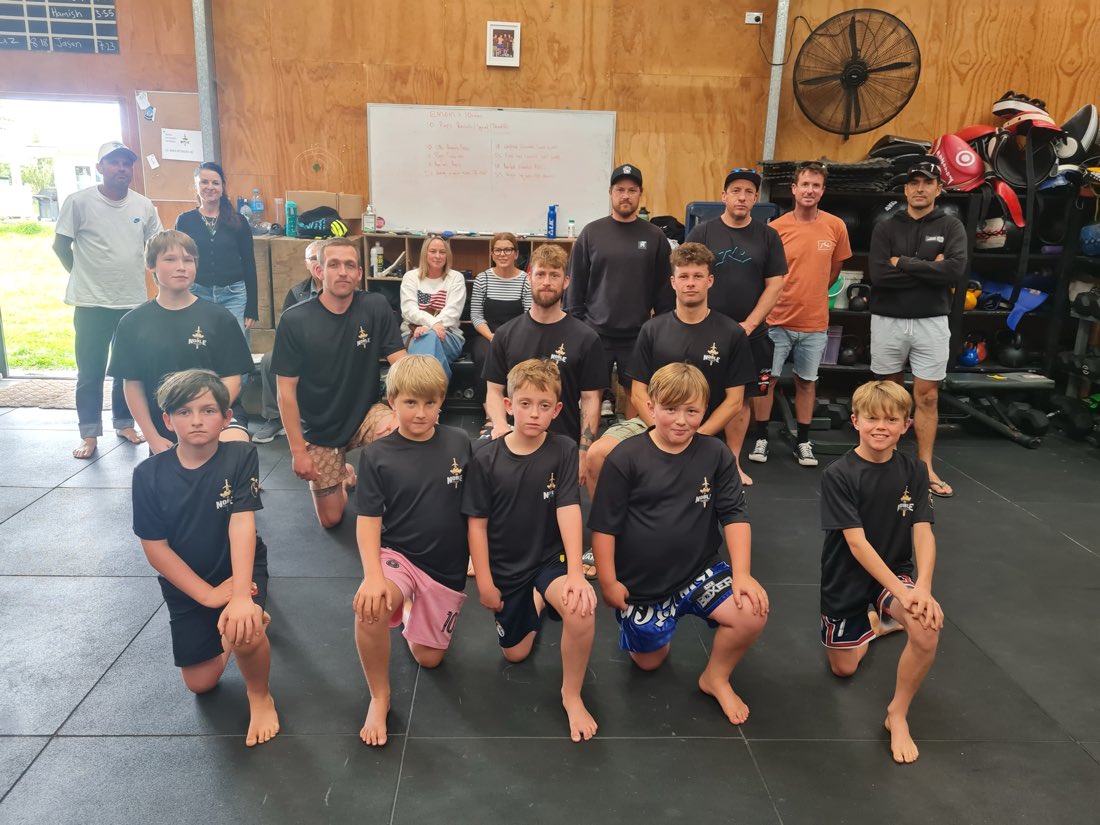 Kids from the Noble Fight kids classes lined up with their coaches